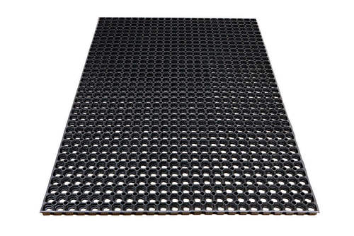 Black perforated mat with evenly spaced circular holes, designed for drainage and traction on floors.
